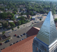 aerial image of the top of a steeple and the streets of Joliet